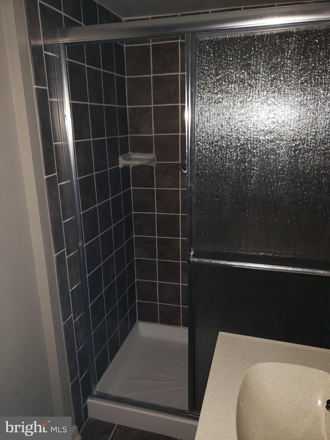 7415 Remoor Road Baltimore, MD 21207 - Photo 31 of 45 a bathroom with a shower