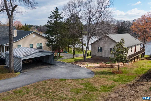 an empty room with a window and a ceiling fan
