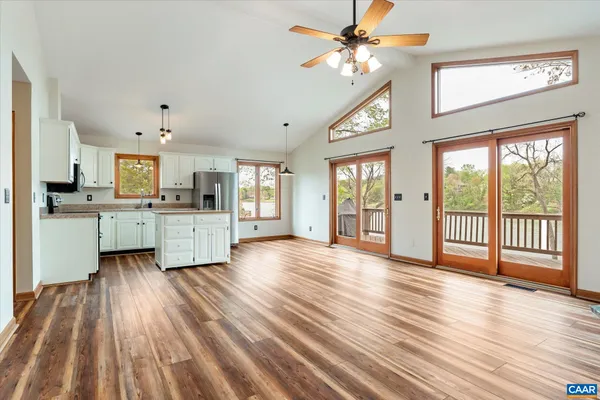 a view of an empty room and a window