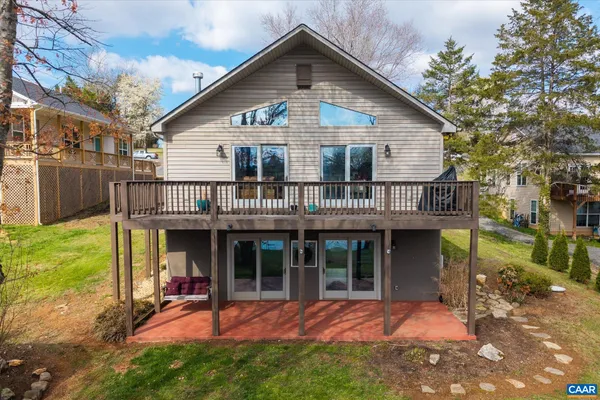 an aerial view of a house with a lake view