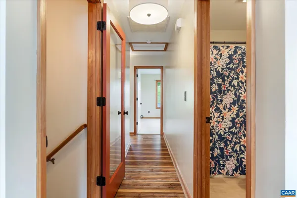 an aerial view of a residential houses with outdoor space and street view