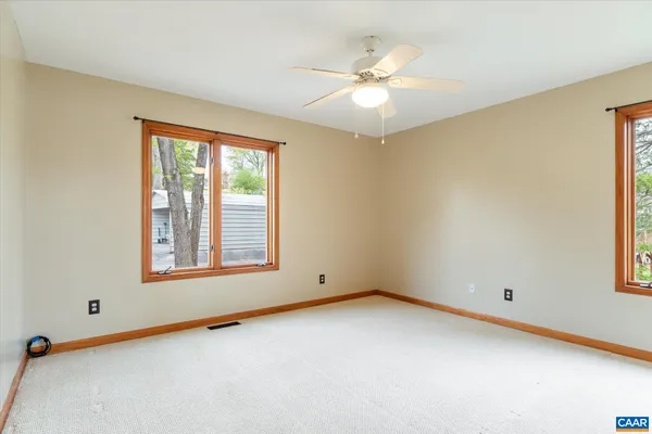an aerial view of lake residential house with outdoor space and trees around