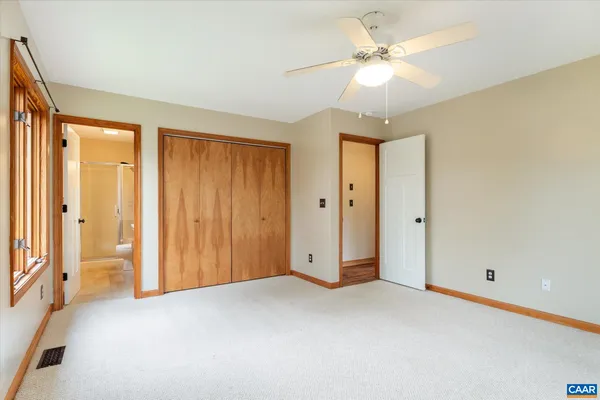 an aerial view of a house with a yard and outdoor seating