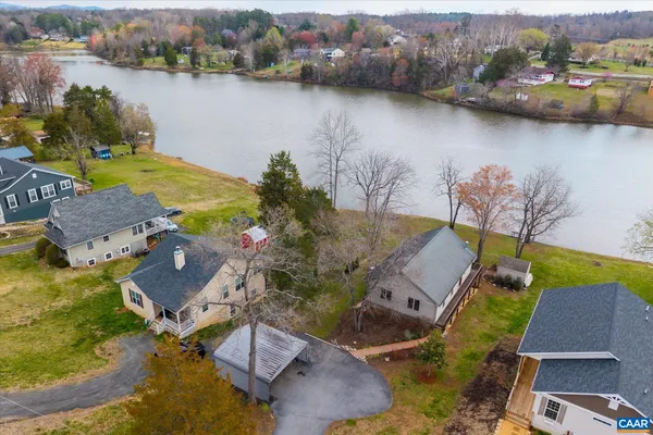 a view of a house with a yard and roof