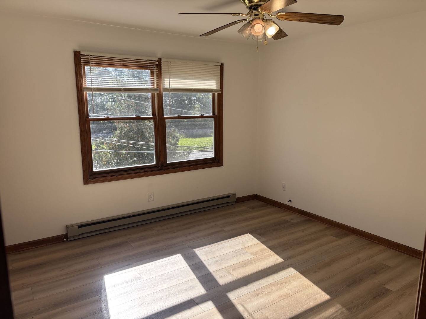 322 West Railroad Street, Unit 3 Marengo, IL 60152 - Photo 17 of 26 an empty room with wooden floor and windows