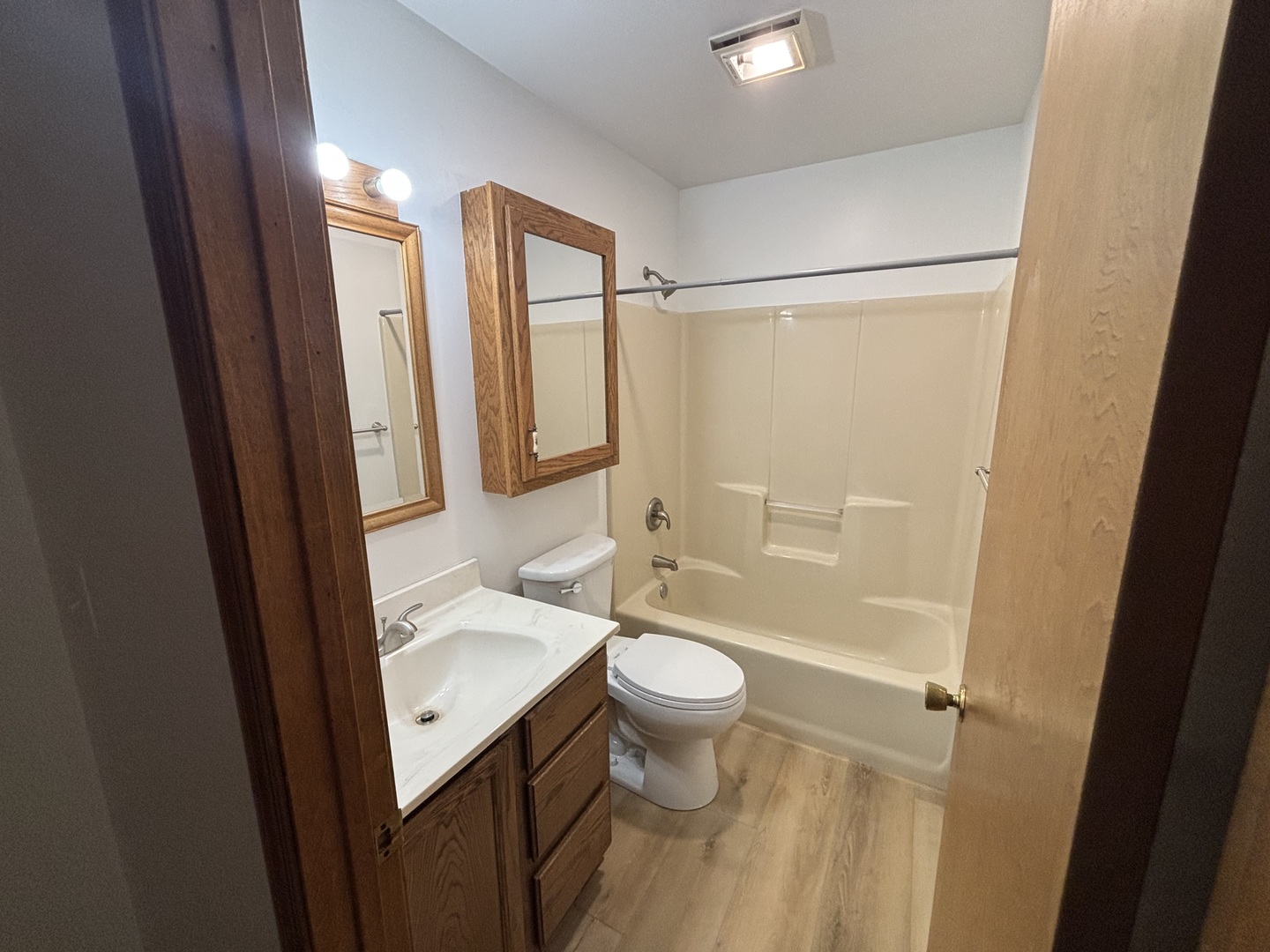 322 West Railroad Street, Unit 3 Marengo, IL 60152 - Photo 20 of 26 a bathroom with a sink a toilet and shower a mirror
