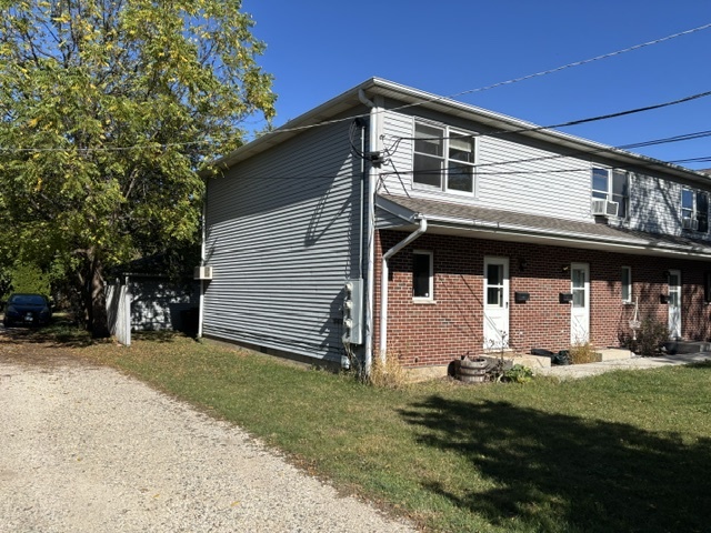 322 West Railroad Street, Unit 3 Marengo, IL 60152 - Photo 2 of 26 a front view of house with yard