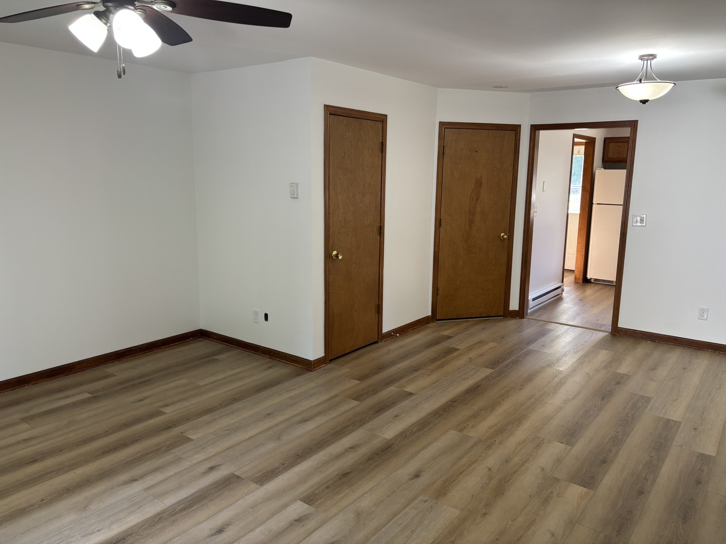322 West Railroad Street, Unit 3 Marengo, IL 60152 - Photo 6 of 26 a view of a livingroom with wooden floor