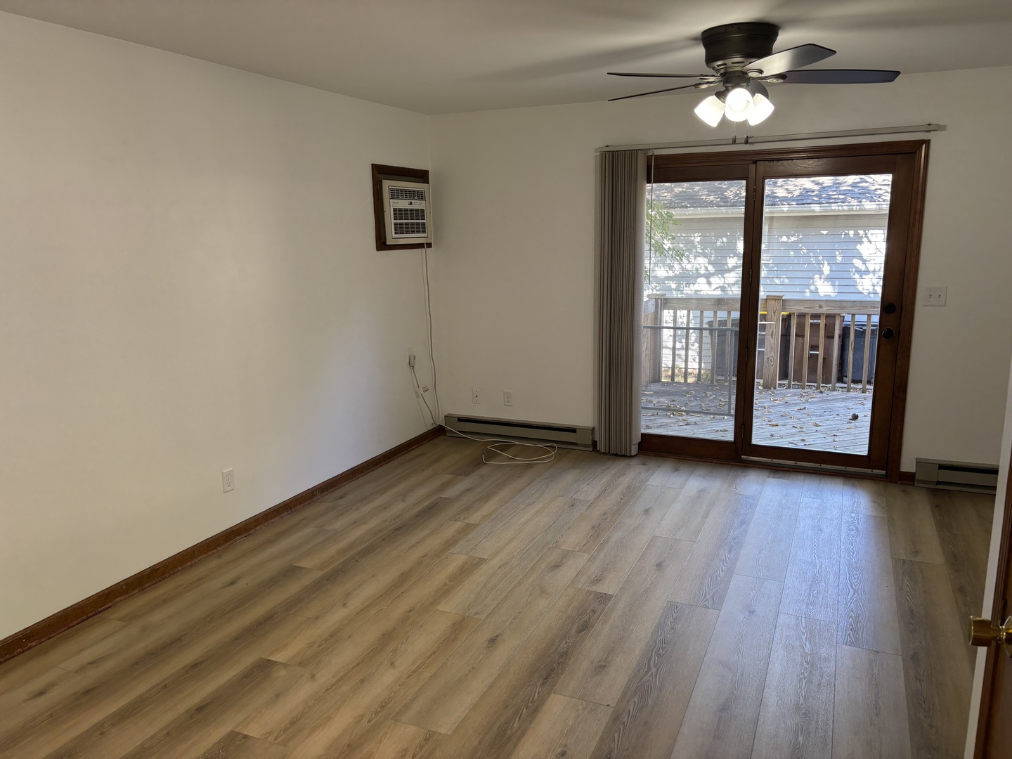 322 West Railroad Street, Unit 3 Marengo, IL 60152 - Photo 7 of 26 wooden floor in an empty room with a window