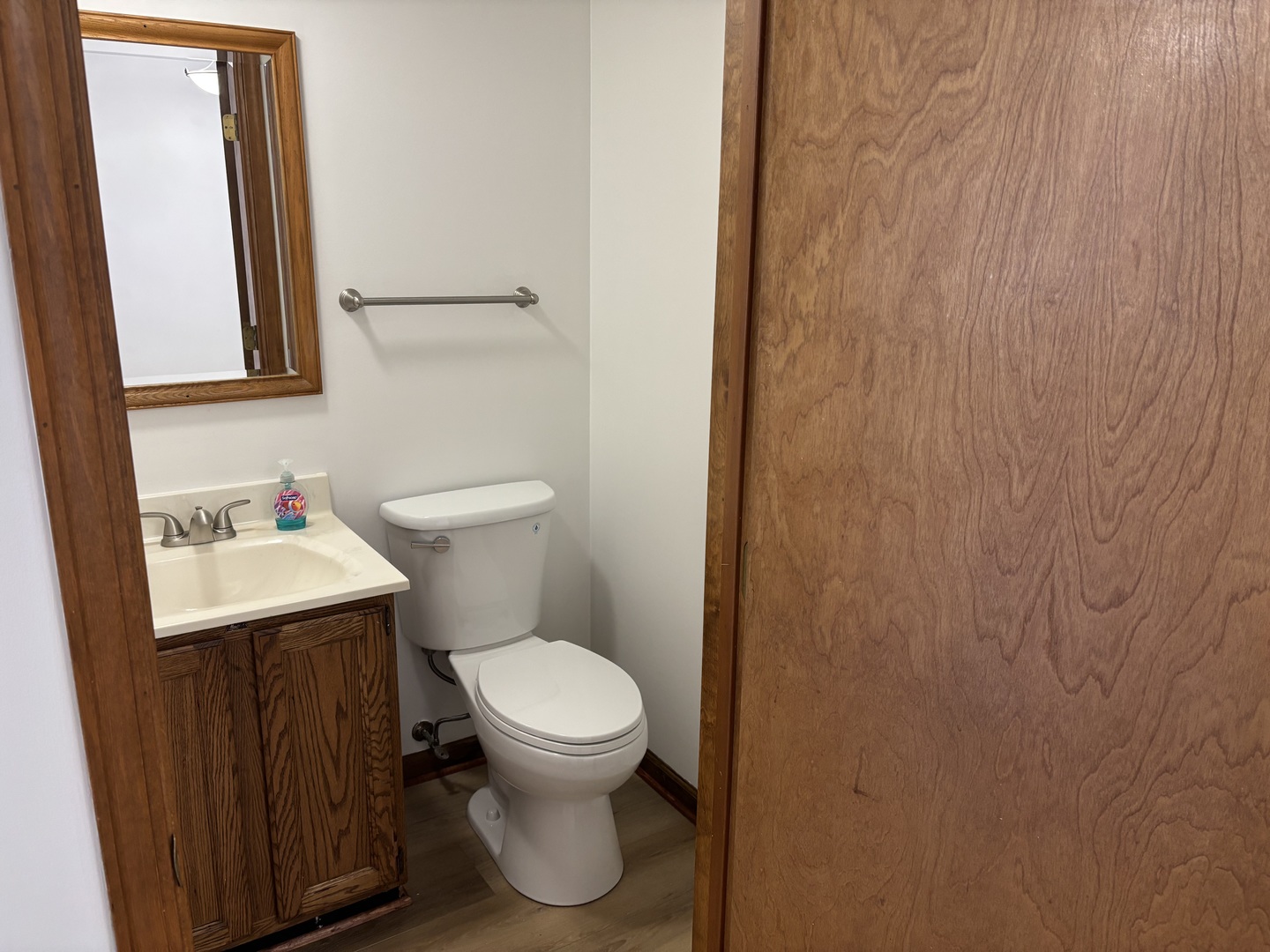 322 West Railroad Street, Unit 3 Marengo, IL 60152 - Photo 9 of 26 a bathroom with a toilet a sink and mirror