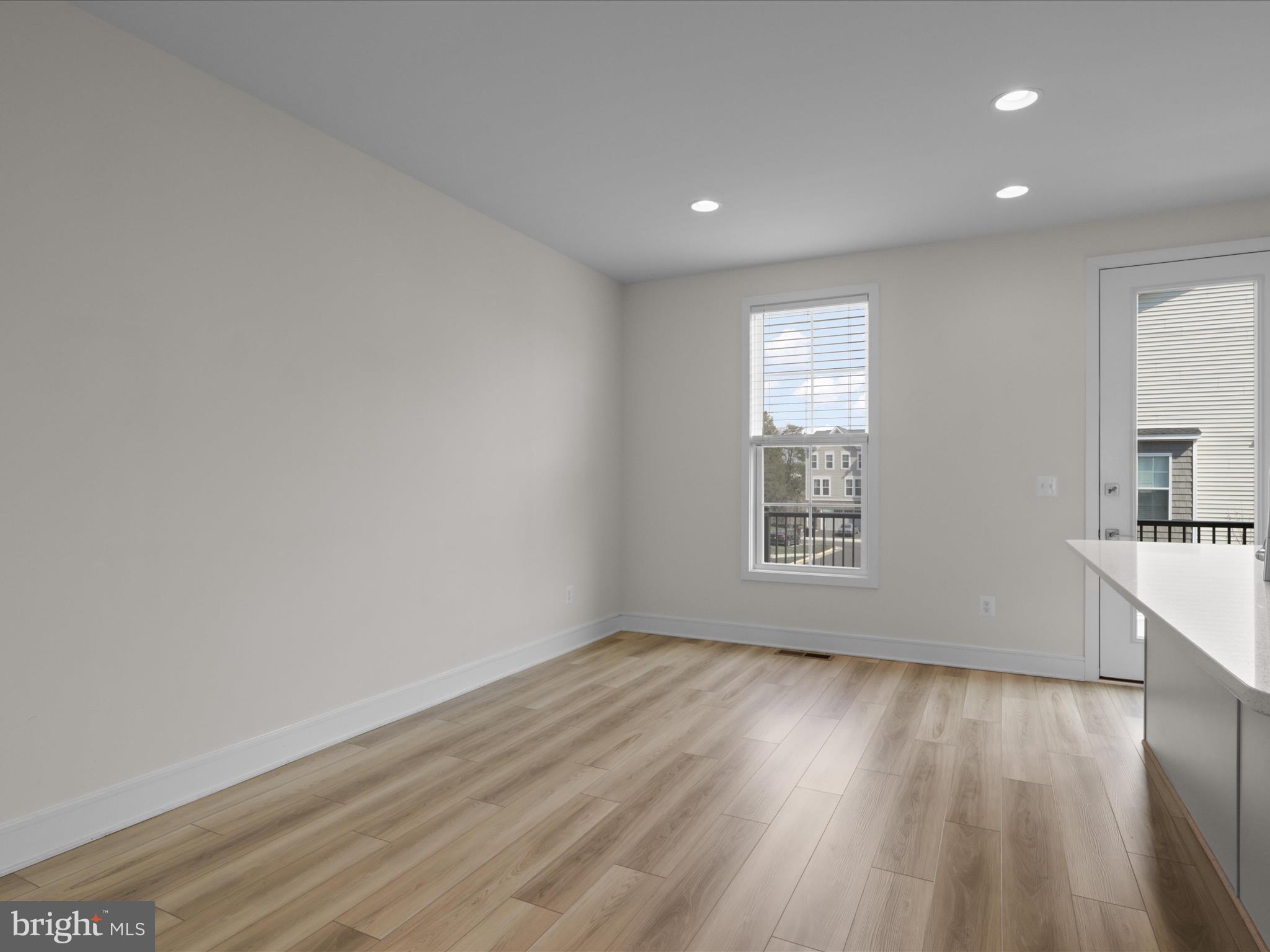 14564 Alsace Lane Gainesville, VA 20155 - Photo 13 of 44 an empty room with wooden floor and windows