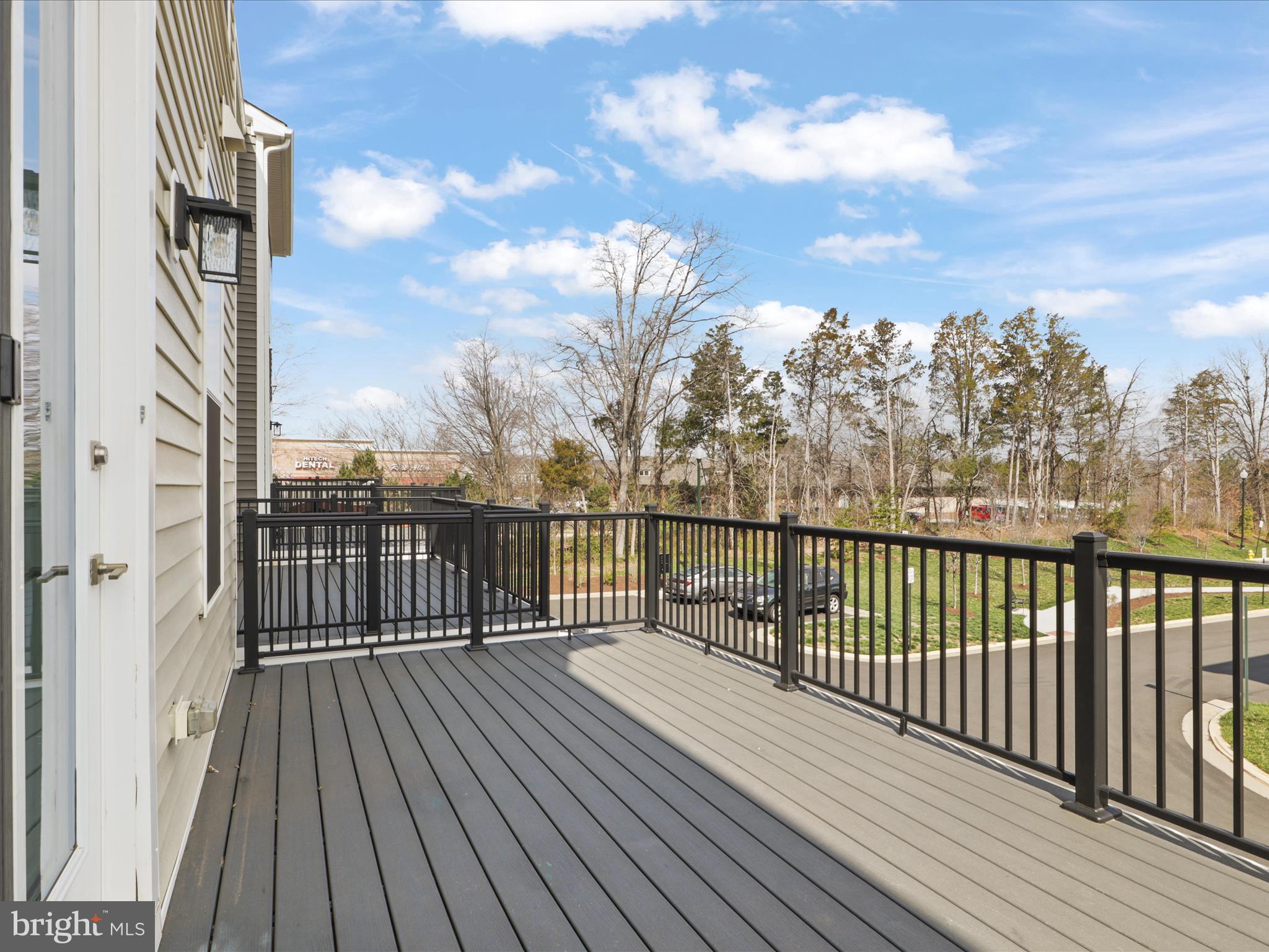 14564 Alsace Lane Gainesville, VA 20155 - Photo 14 of 44 a view of balcony with wooden floor and fence