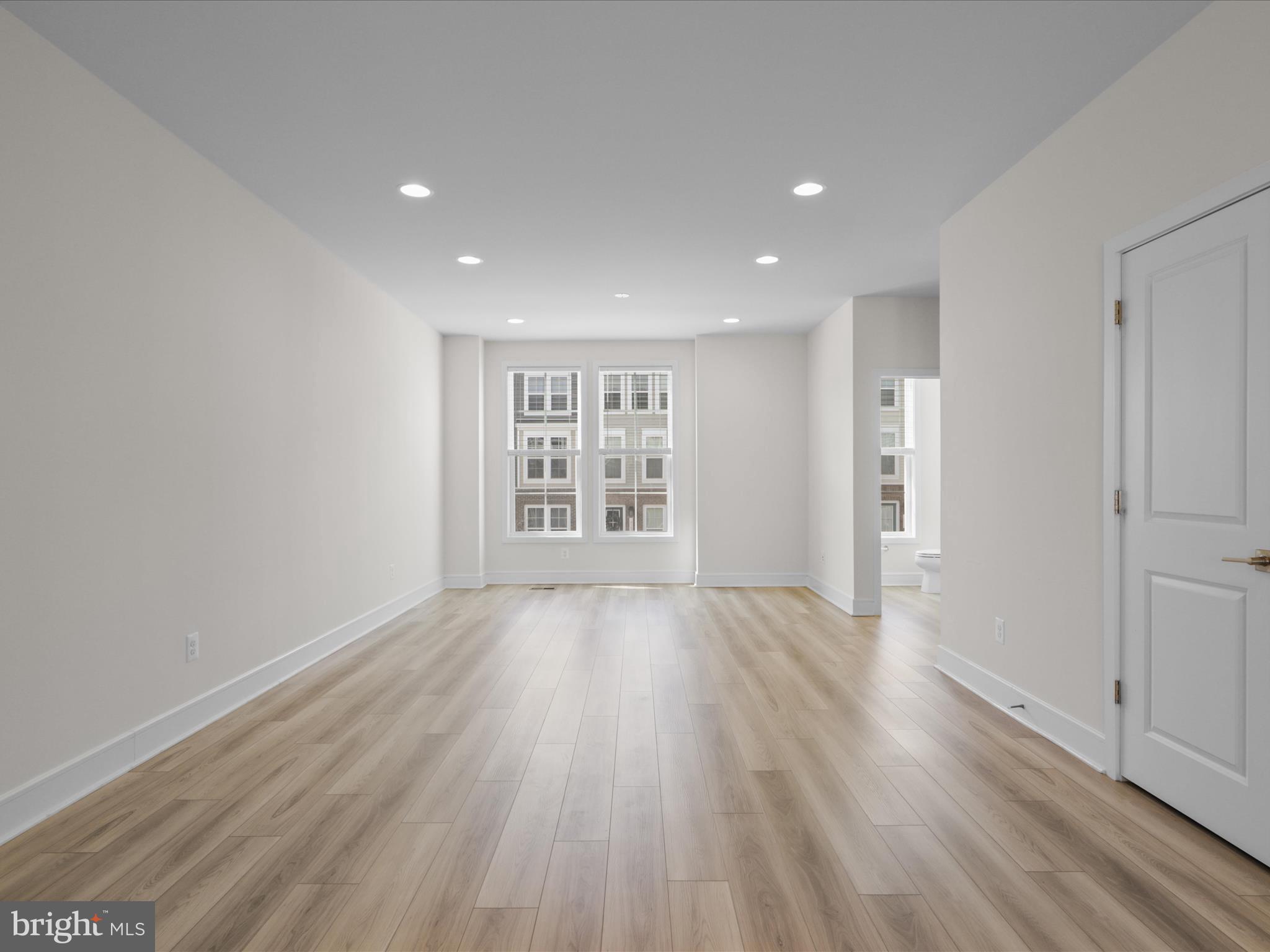 14564 Alsace Lane Gainesville, VA 20155 - Photo 15 of 44 wooden floor in an empty room with a window