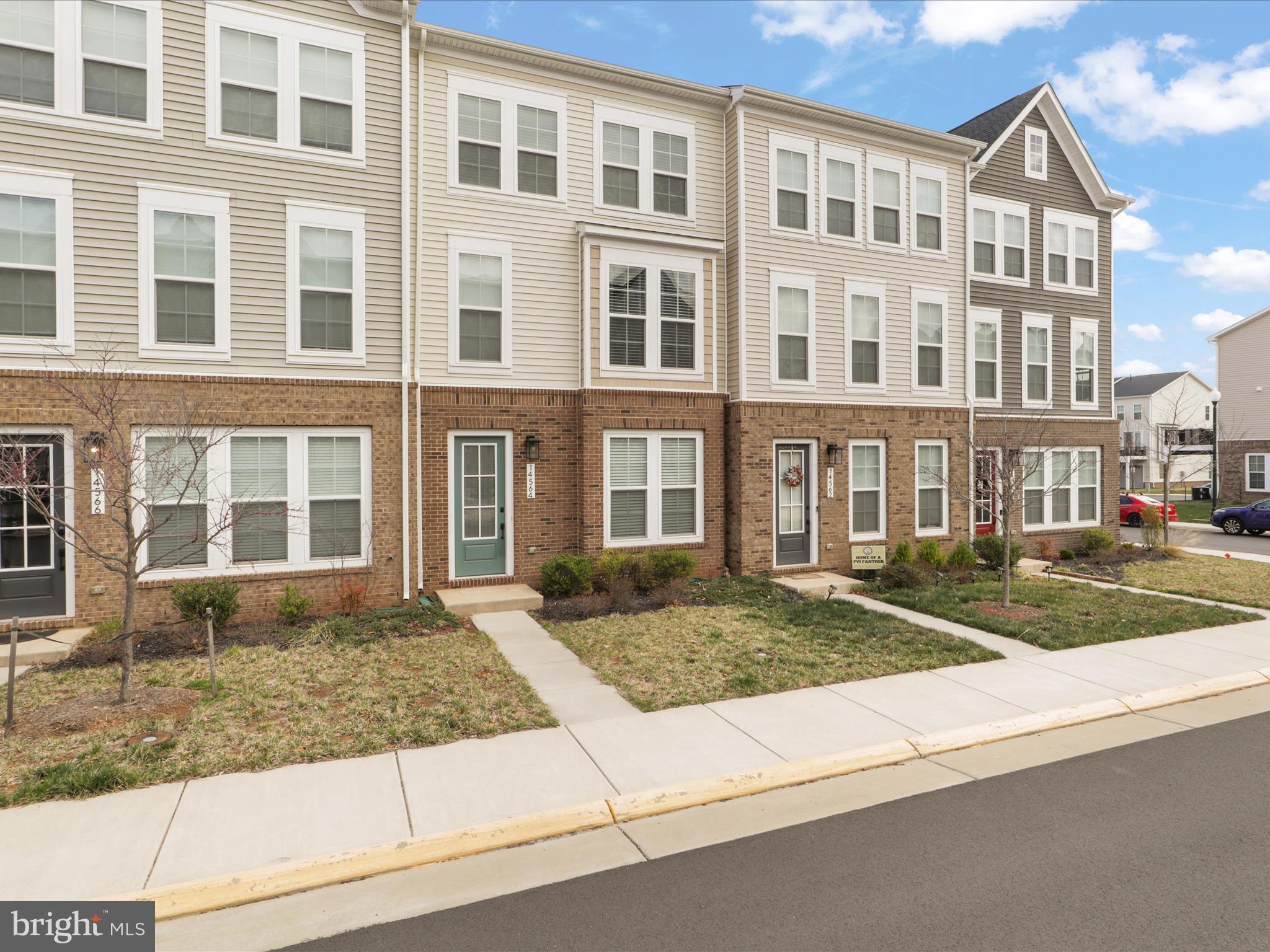 14564 Alsace Lane Gainesville, VA 20155 - Photo 2 of 44 a view of a brick building next to a yard