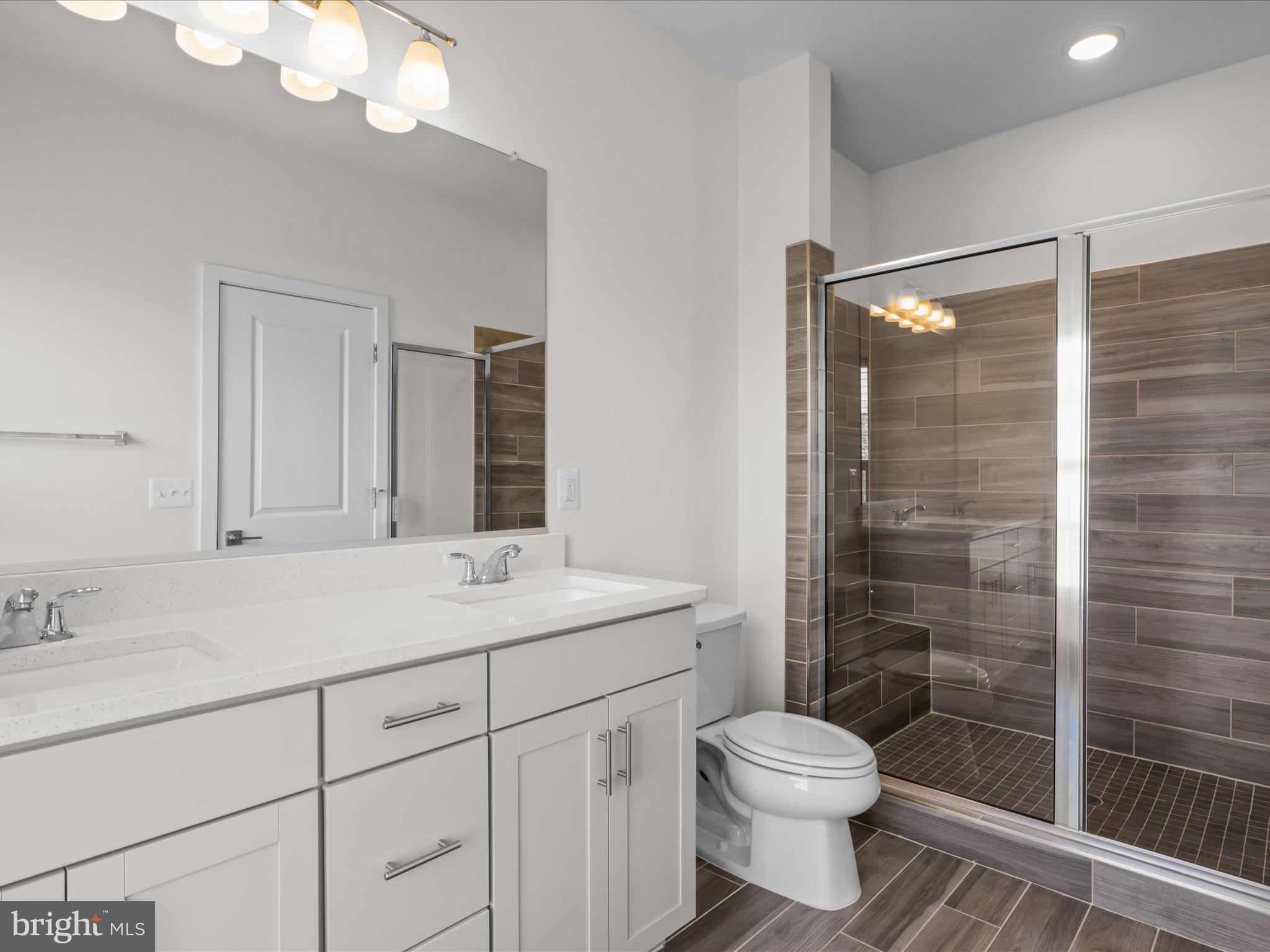 14564 Alsace Lane Gainesville, VA 20155 - Photo 22 of 44 a bathroom with a sink a toilet and shower