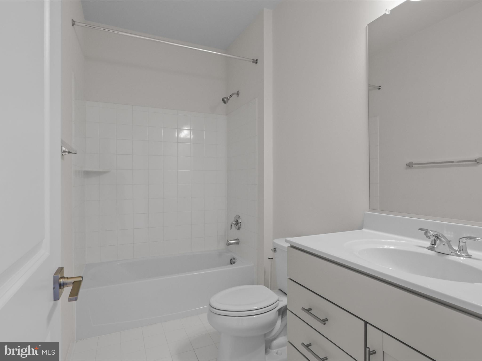 14564 Alsace Lane Gainesville, VA 20155 - Photo 29 of 44 a bathroom with a granite countertop sink a toilet and shower