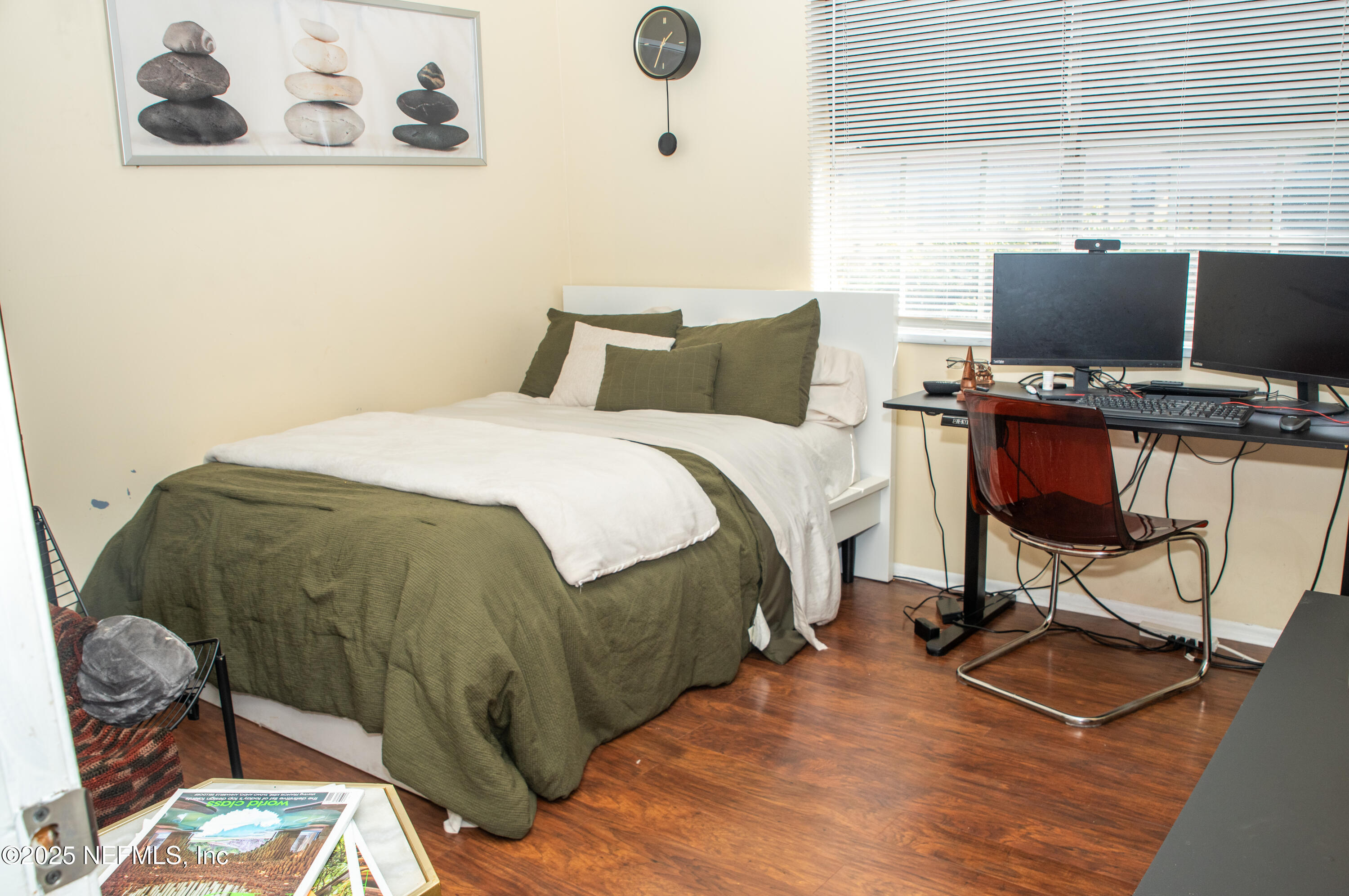 4822 Windrush Lane Jacksonville, FL 32217 - Photo 11 of 13 a bedroom with a bed and a desk