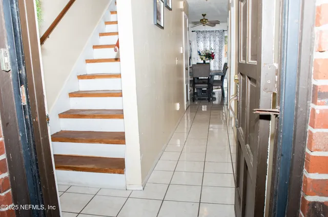 a living room with furniture and flowers