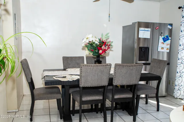 a kitchen with white cabinets and appliances