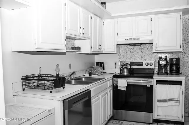 a bathroom with a sink mirror and toilet