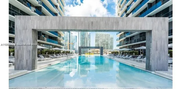 a view of outdoor kitchen and dining room