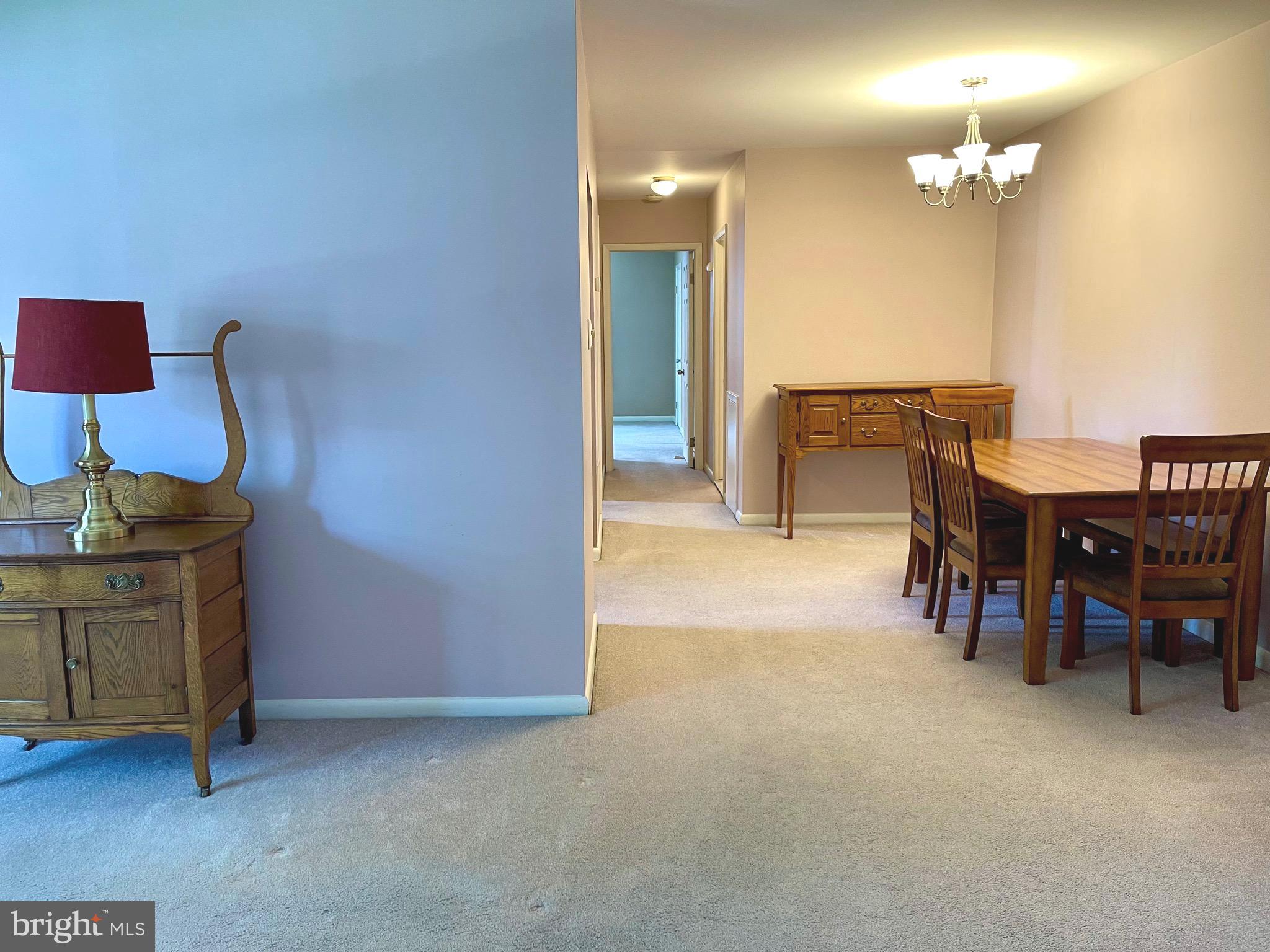 804 South Avenue, Unit D7 Secane, PA 19018 - Photo 11 of 35 a view of a livingroom with furniture and a chandelier