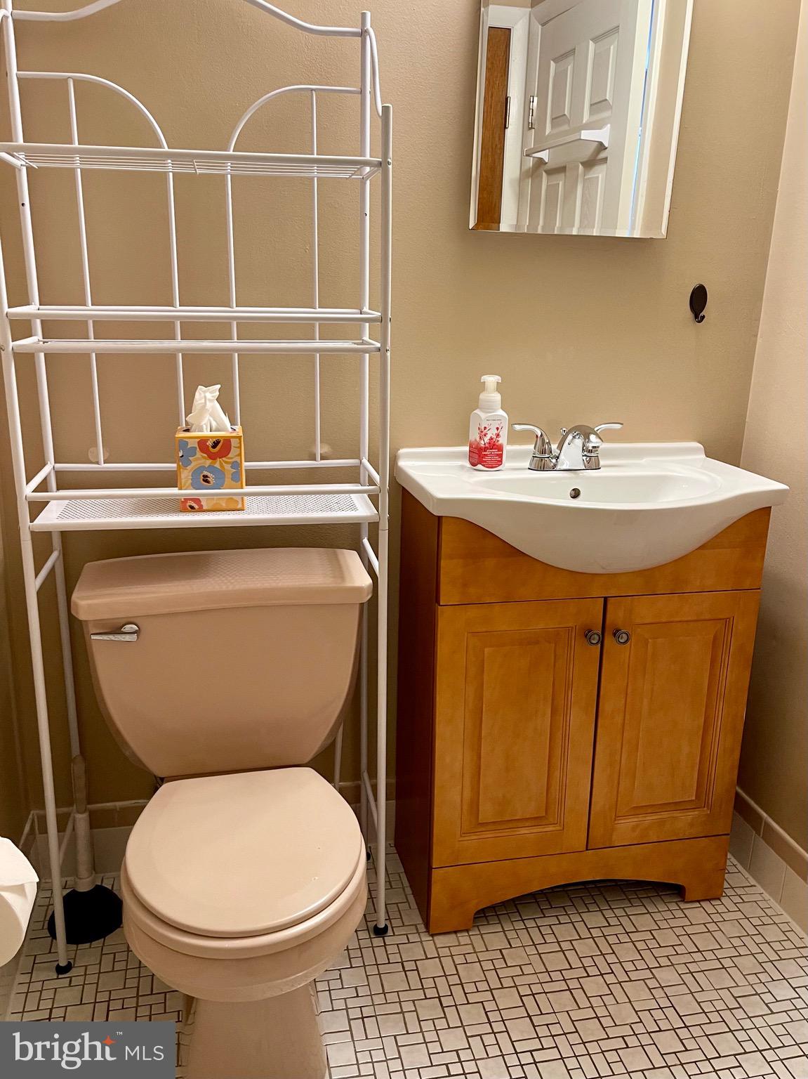 804 South Avenue, Unit D7 Secane, PA 19018 - Photo 24 of 35 a bathroom with a toilet a sink and a window