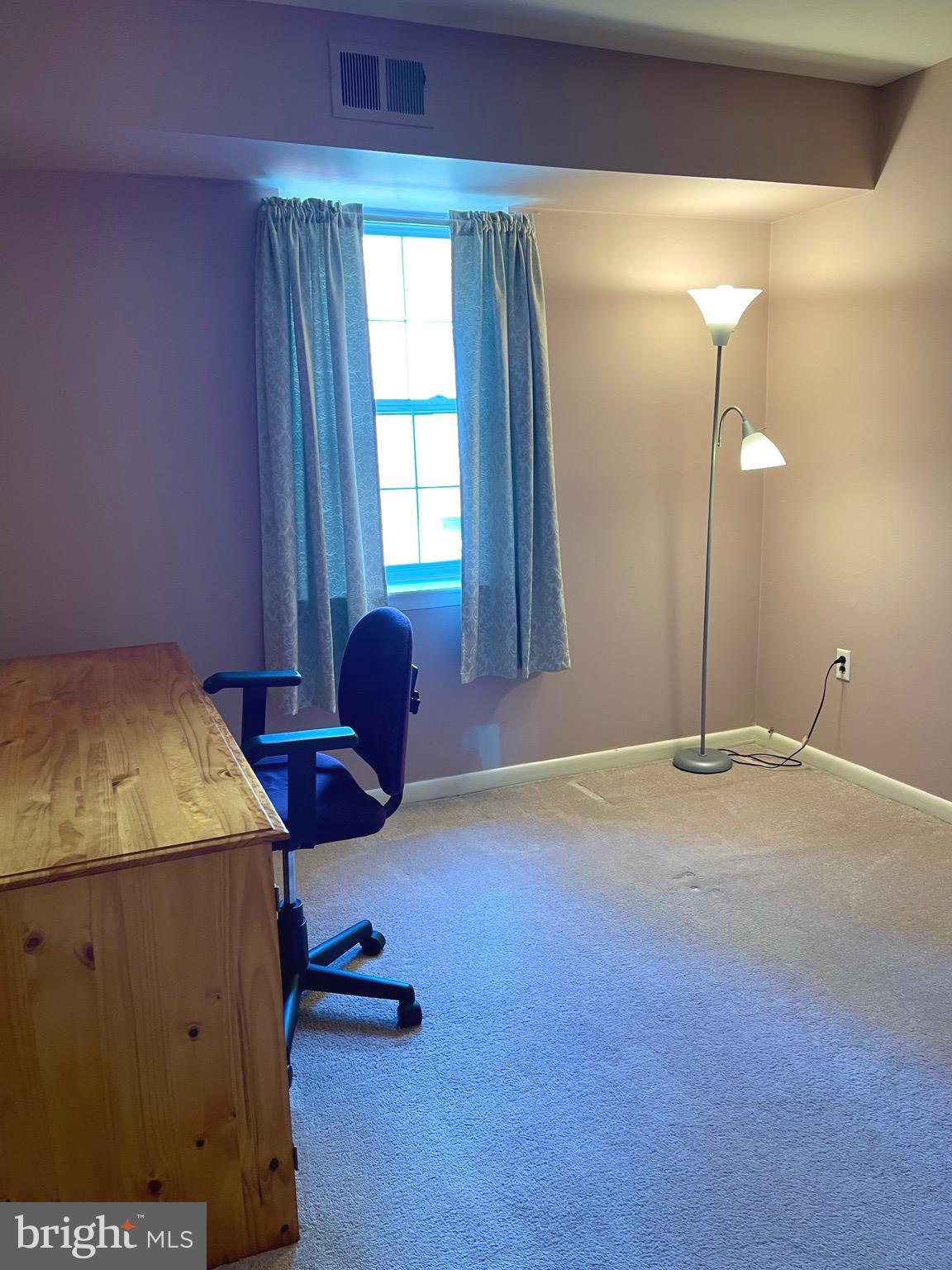 804 South Avenue, Unit D7 Secane, PA 19018 - Photo 25 of 35 a bedroom with a bed and window