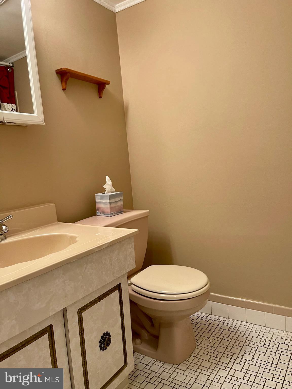804 South Avenue, Unit D7 Secane, PA 19018 - Photo 27 of 33 a bathroom with a sink a toilet and a vanity
