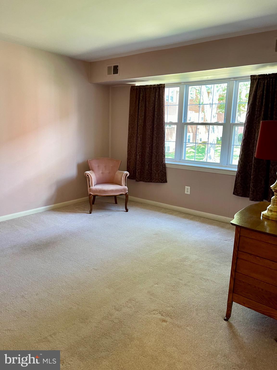 804 South Avenue, Unit D7 Secane, PA 19018 - Photo 7 of 33 a living room with furniture and a window