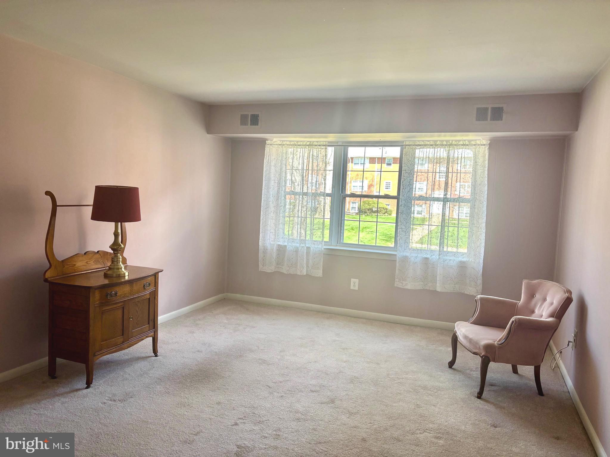 804 South Avenue, Unit D7 Secane, PA 19018 - Photo 8 of 35 a living room with furniture and a window