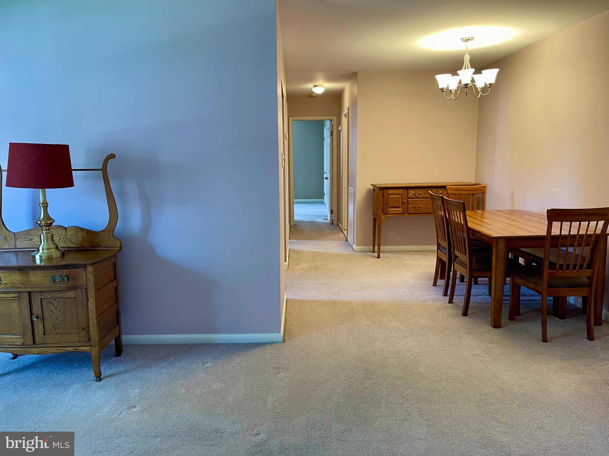 804 South Avenue, Unit D7 Secane, PA 19018 - Photo 9 of 33 a view of dining room with furniture and a chandelier