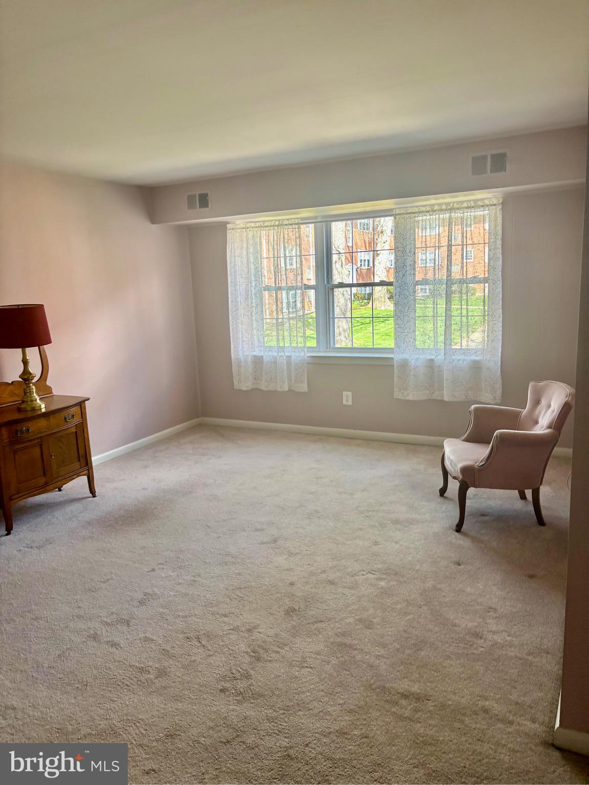 804 South Avenue, Unit D7 Secane, PA 19018 - Photo 9 of 35 a living room with furniture and a window