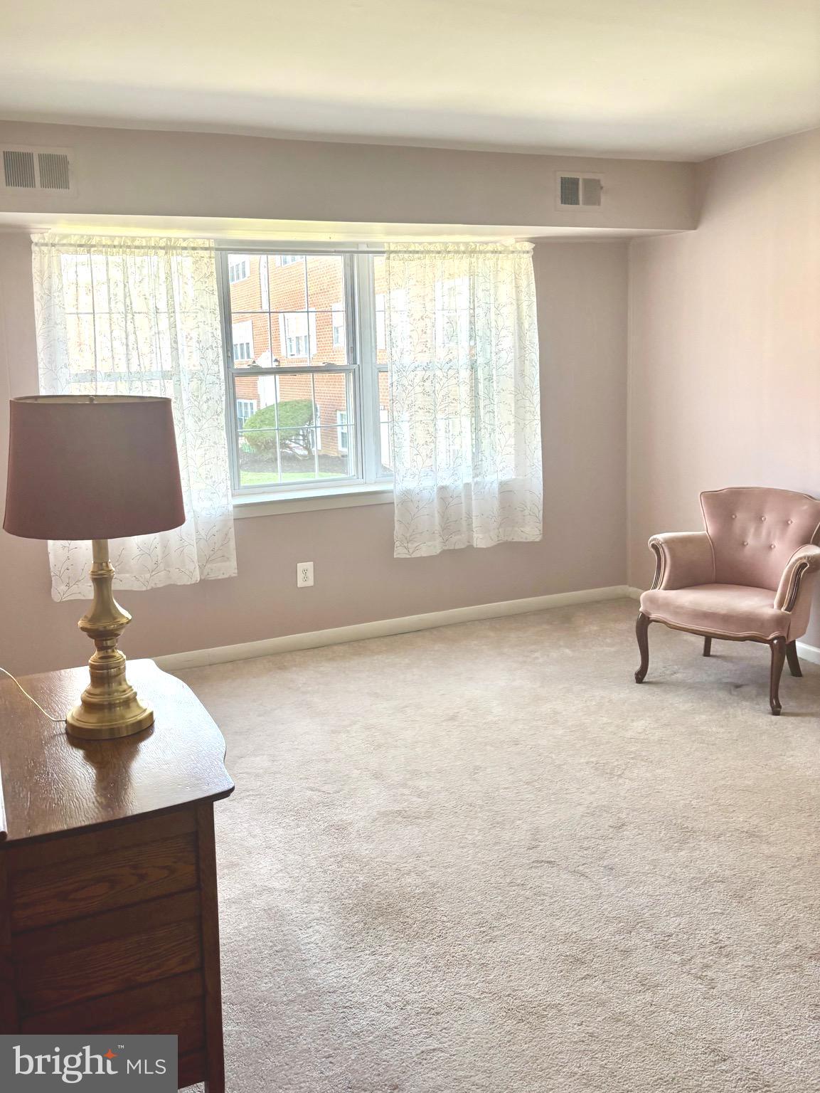 804 South Avenue, Unit D7 Secane, PA 19018 - Photo 10 of 35 a living room with furniture and a window
