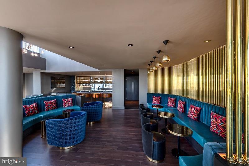 1201 Half Street Southwest, Unit PH1201 Washington, DC 20003 - Photo 24 of 26 a living room with furniture and a flat screen tv