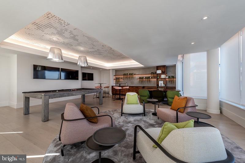 1201 Half Street Southwest, Unit PH1201 Washington, DC 20003 - Photo 25 of 26 a living room with furniture and kitchen view