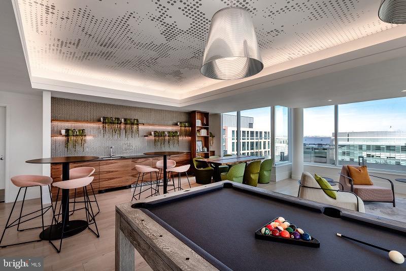 1201 Half Street Southwest, Unit PH1201 Washington, DC 20003 - Photo 26 of 26 a living room with furniture and a floor to ceiling window