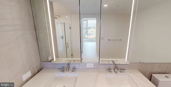 a bathroom with a tub sink and mirror