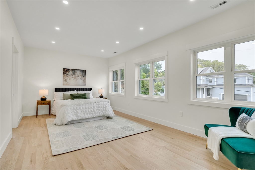 22 Estabrook Road Lexington, MA 02421 - Photo 22 of 35 a bedroom with furniture and a large window