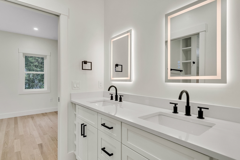 22 Estabrook Road Lexington, MA 02421 - Photo 24 of 35 a bathroom with double vanity sink two mirror and window