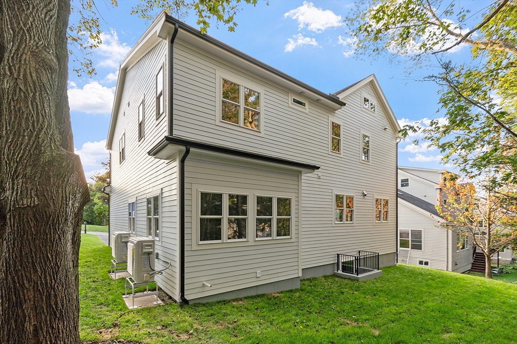 22 Estabrook Road Lexington, MA 02421 - Photo 5 of 35 a view of a house with a yard