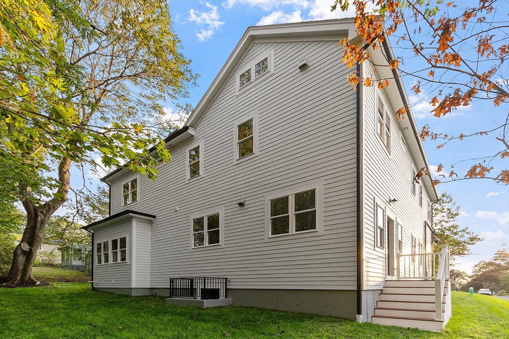 22 Estabrook Road Lexington, MA 02421 - Photo 6 of 35 a view of a house with a yard