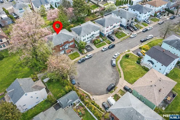 an aerial view of a house with a swimming pool