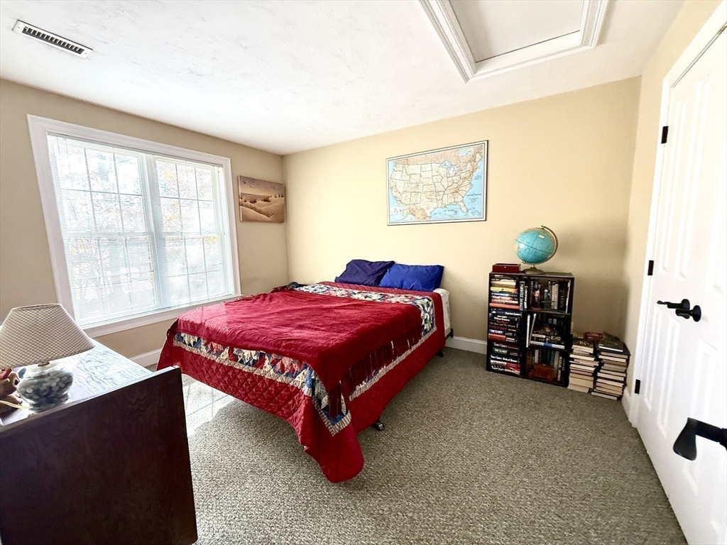 63 Providence Road, Unit 2 Grafton, MA 01519 - Photo 6 of 9 a bedroom with a bed and a window