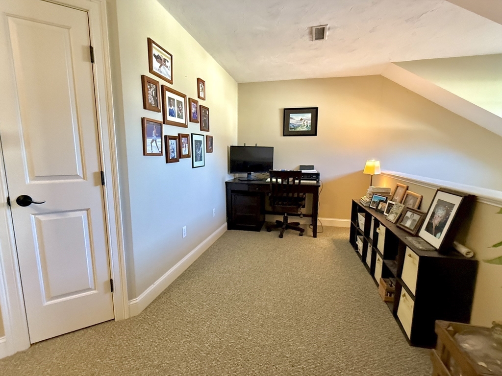 63 Providence Road, Unit 2 Grafton, MA 01519 - Photo 8 of 9 a view of a workspace with furniture and a window
