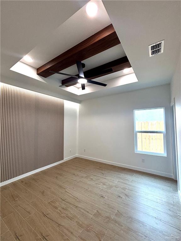4 Estevan Street Mission, TX 78573 - Photo 11 of 24 an empty room with wooden floor and windows