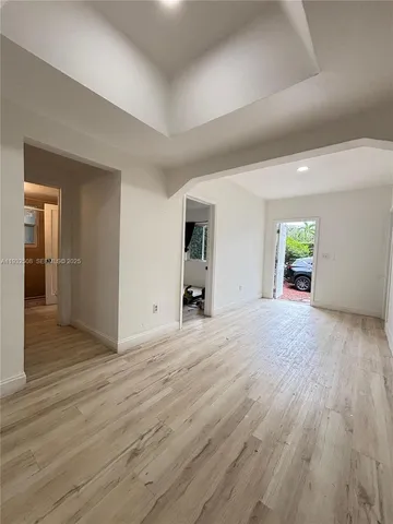 wooden floor and empty room with a window