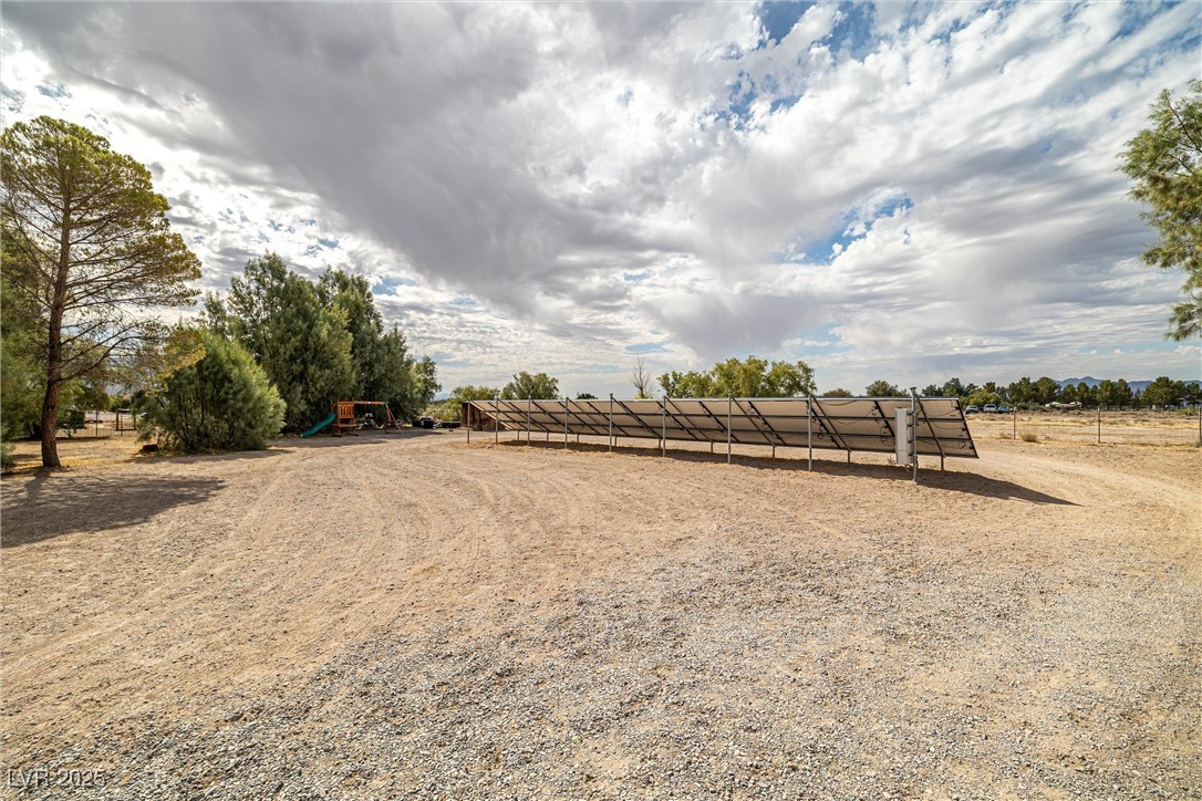 3951 West Blosser Ranch Road Pahrump, NV 89060 - Photo 30 of 35 View of yard with a rural view and a playground