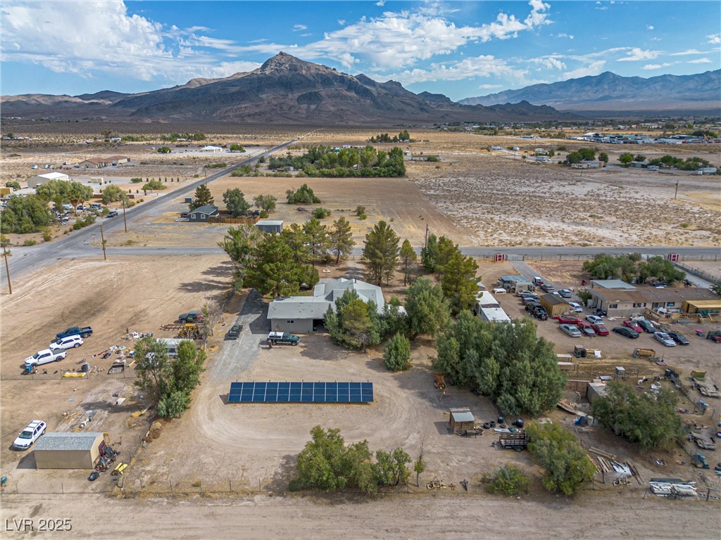 3951 West Blosser Ranch Road Pahrump, NV 89060 - Photo 3 of 35 View of rural area featuring a mountainous background