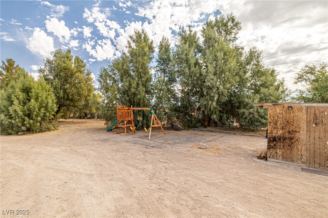 3951 West Blosser Ranch Road Pahrump, NV 89060 - Photo 32 of 35 Communal playground featuring view of scattered trees